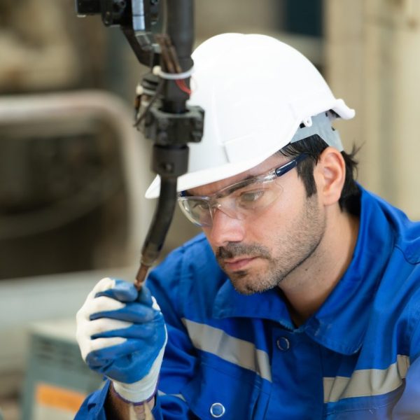 young-male-engineers-with-experience-are-maintaining-and-testing-the-functionality-of-welding-robots
